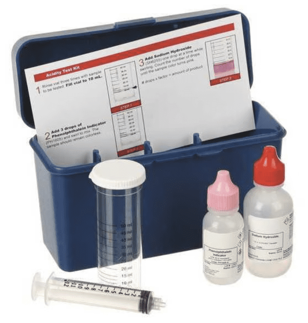 Acidity test kit with chemicals and syringe.